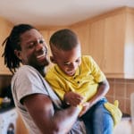 man raising his son with a health self esteem