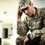 young military member feeling depressed