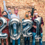 young adults celebrate 2021 with masks on