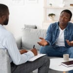 man talks to therapist about medication