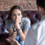 young women looks off to distance during therapy